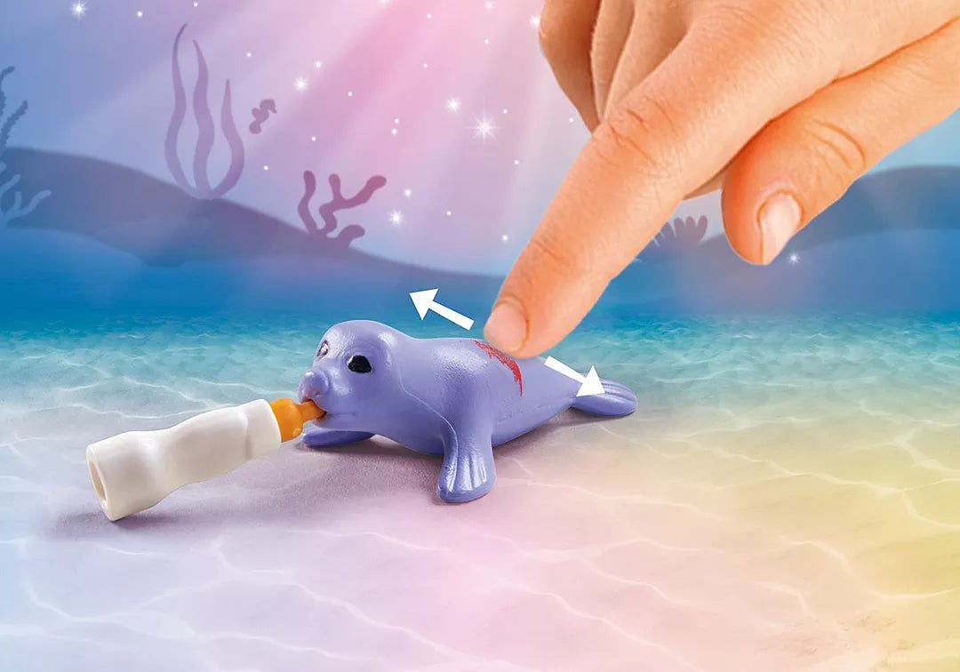 Princess Magic | Mermaid Animal Care shows a hand caring for a purple seal with a milk bottle underwater toy scene.