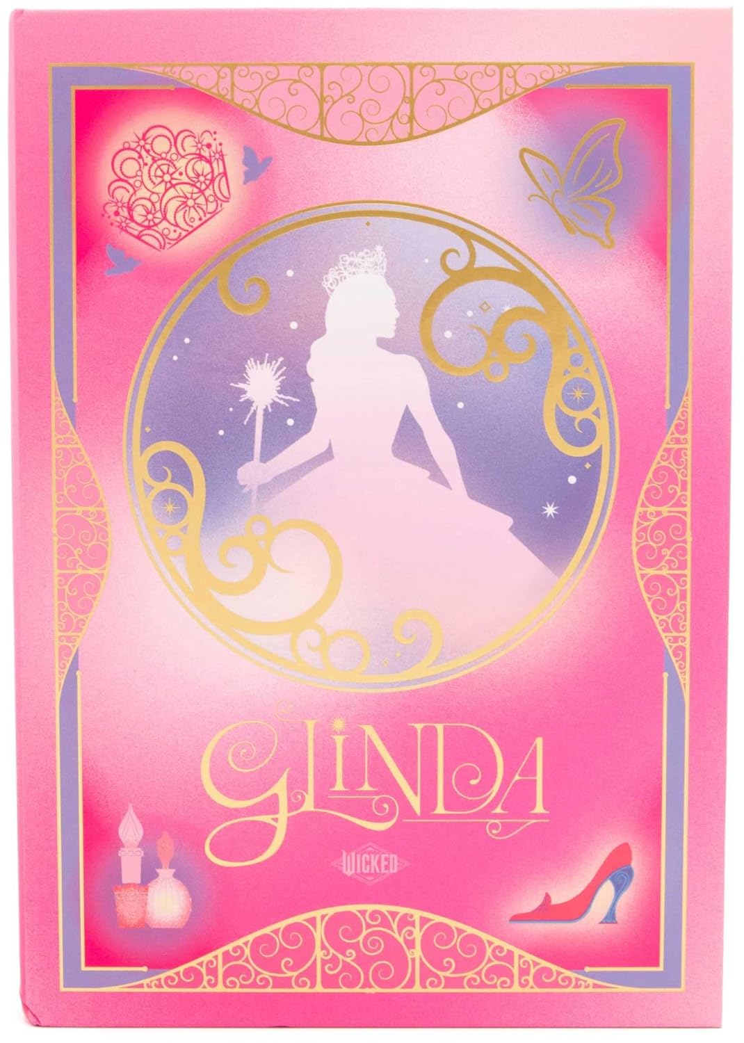 Wicked Glinda Journal featuring a pink hardcover with Glinda silhouette, magical motifs, and gold decorative accents.