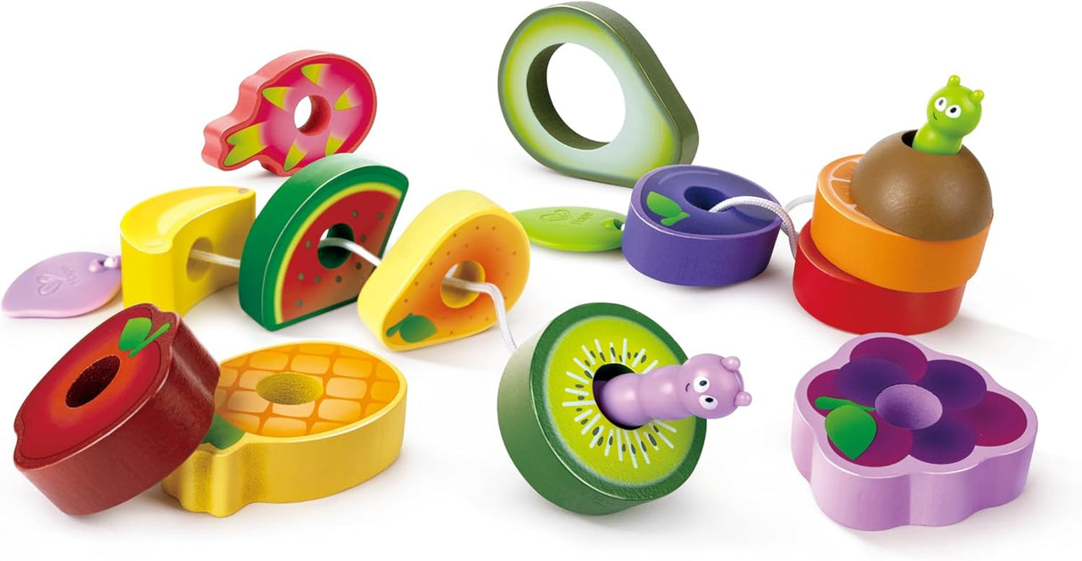 Colorful wooden fruit pieces with caterpillar characters threading through each for a playful snack stringing activity