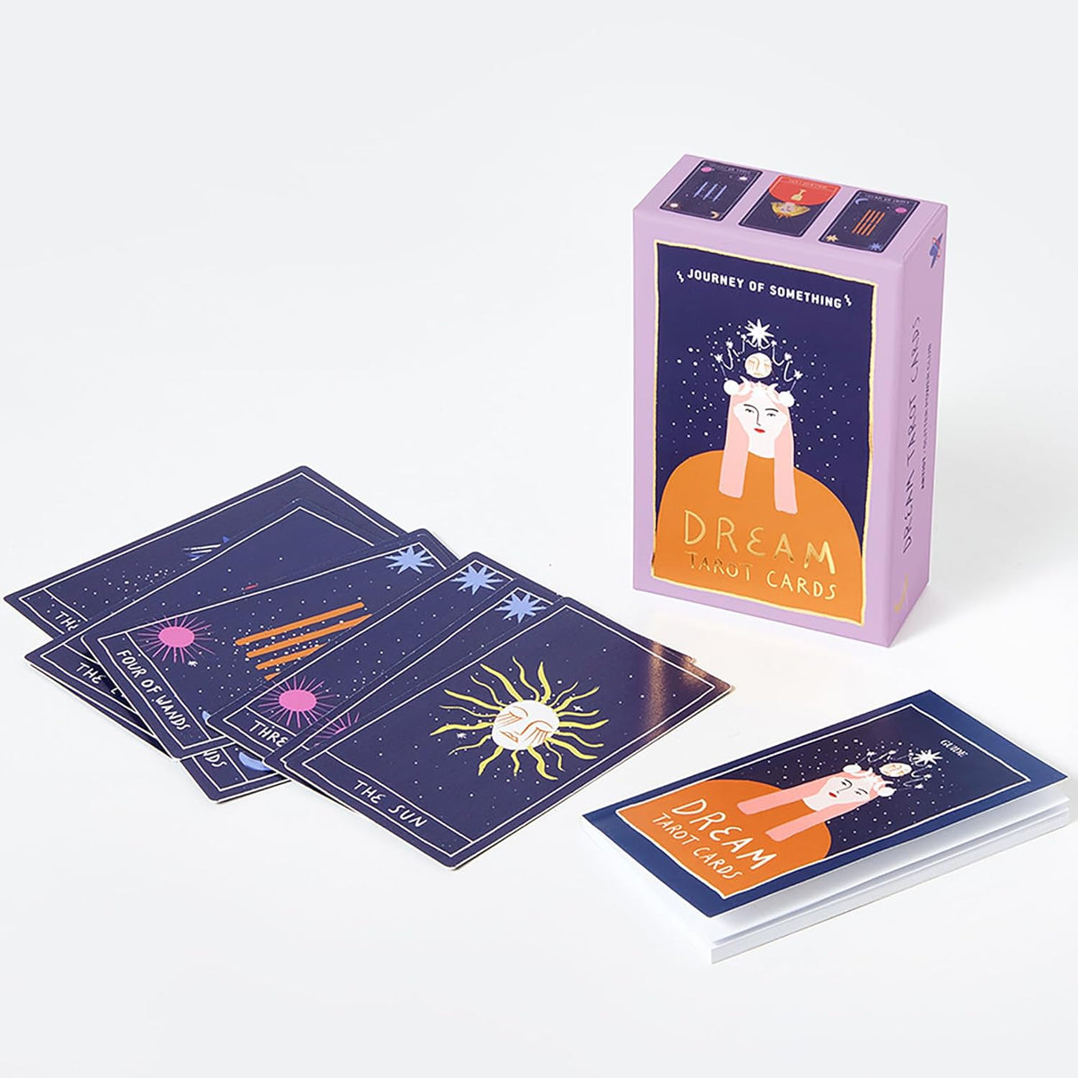 Dream Tarot Cards deck with colorful celestial and symbolic illustrations displayed alongside its purple box and guidebook.