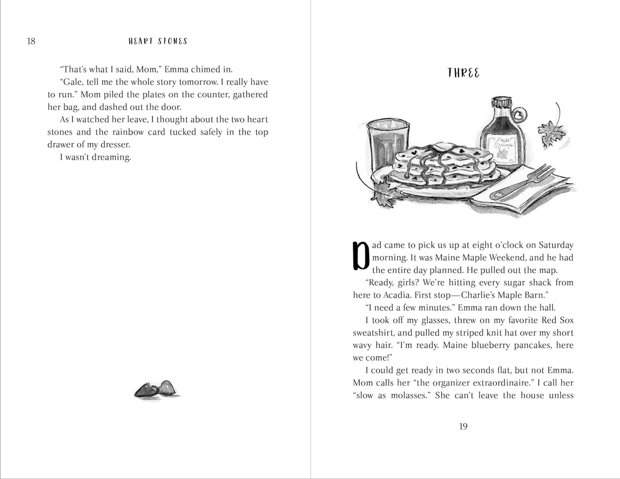 Open book pages of the middle grade novel Heart Stones showing text and an illustration of pancakes with syrup and a bottle.