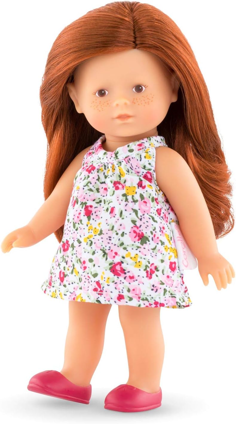 Mini Corolline Ruby doll with long red hair, floral dress, hazel eyes, and pink molded shoes, aged 3+.