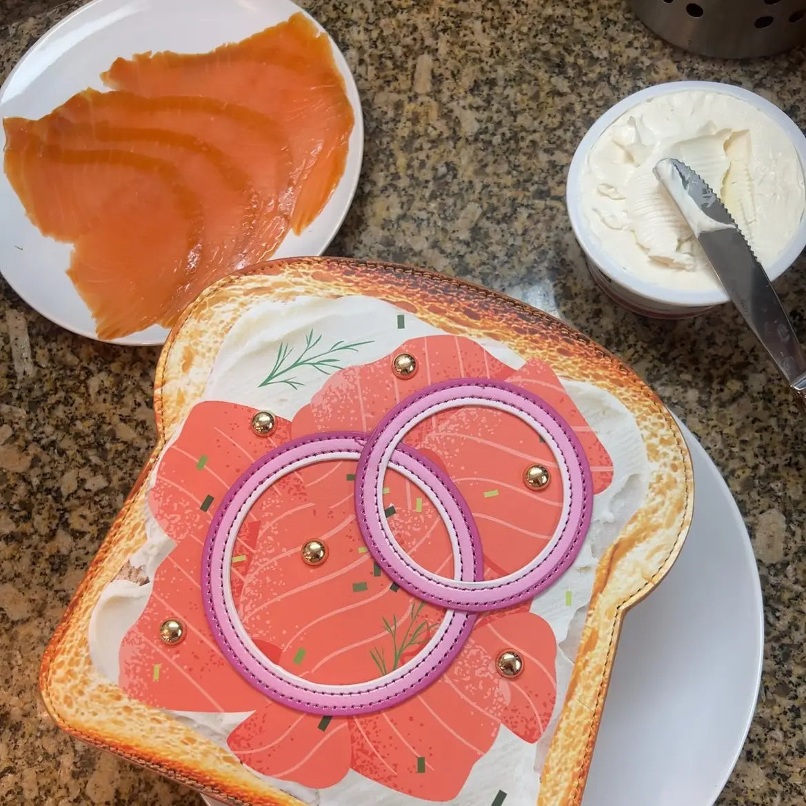 Crossbody Handbag | Smoked Salmon Toast with realistic smoked salmon, lemon slices, and greens on golden toast base.