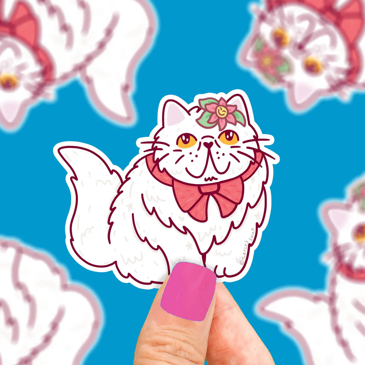 Persian Cat with Bow Sticker showing a white fluffy cat with a pink bow and floral headpiece on blue background.