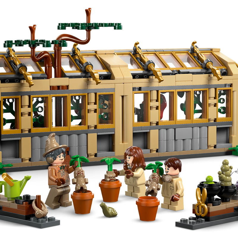 Harry Potter Hogwarts Castle: Herbology Class LEGO set with greenhouse, Mandrake plants, and minifigures gardening.