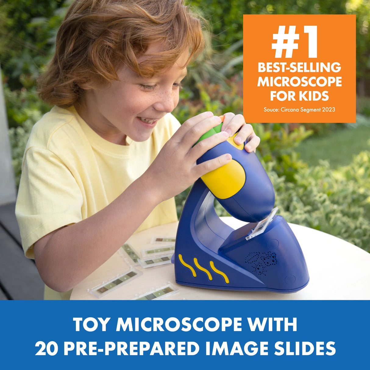 Child using GeoSafari Jr Talking Microscope with 20 pre-prepared slides, learning about science in a friendly setting.