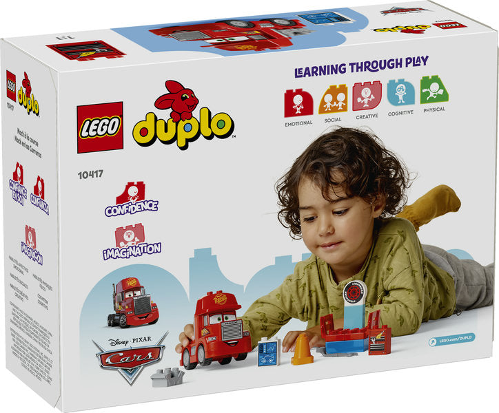 LEGO Duplo Mack at the Race set with a toddler playing, featuring Disney Pixar Cars buildable truck and tuning station.