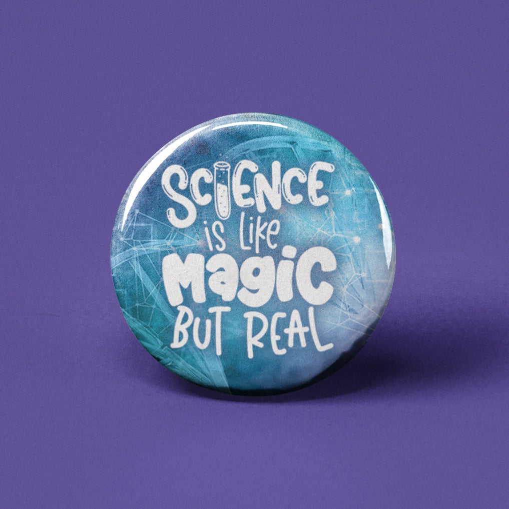 Button | Science is Like Magic But Real with a blue background and white lettering on a 1.25-inch pinback button.