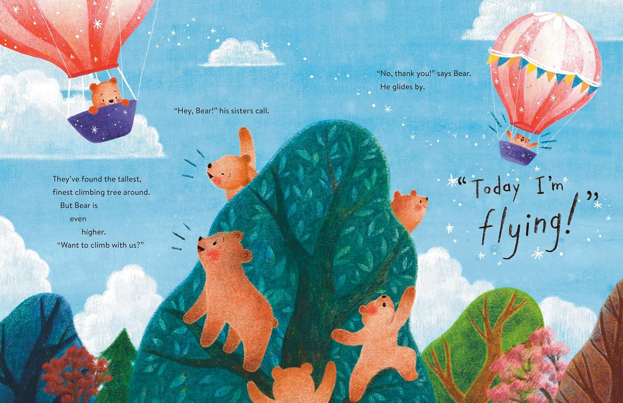 Bear in the Air shows a bear soaring alone in a colorful hot air balloon above his friends climbing trees.
