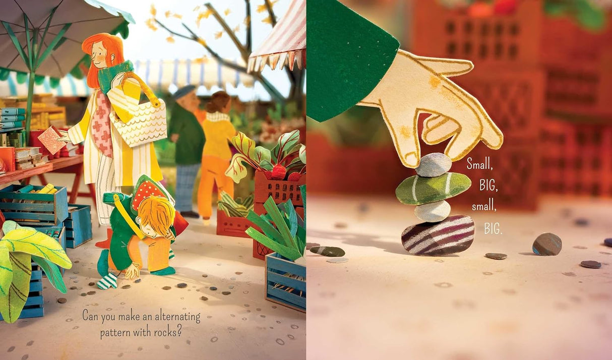 Look book showing colorful diorama illustrations of children exploring nature and stacking patterned rocks outdoors.