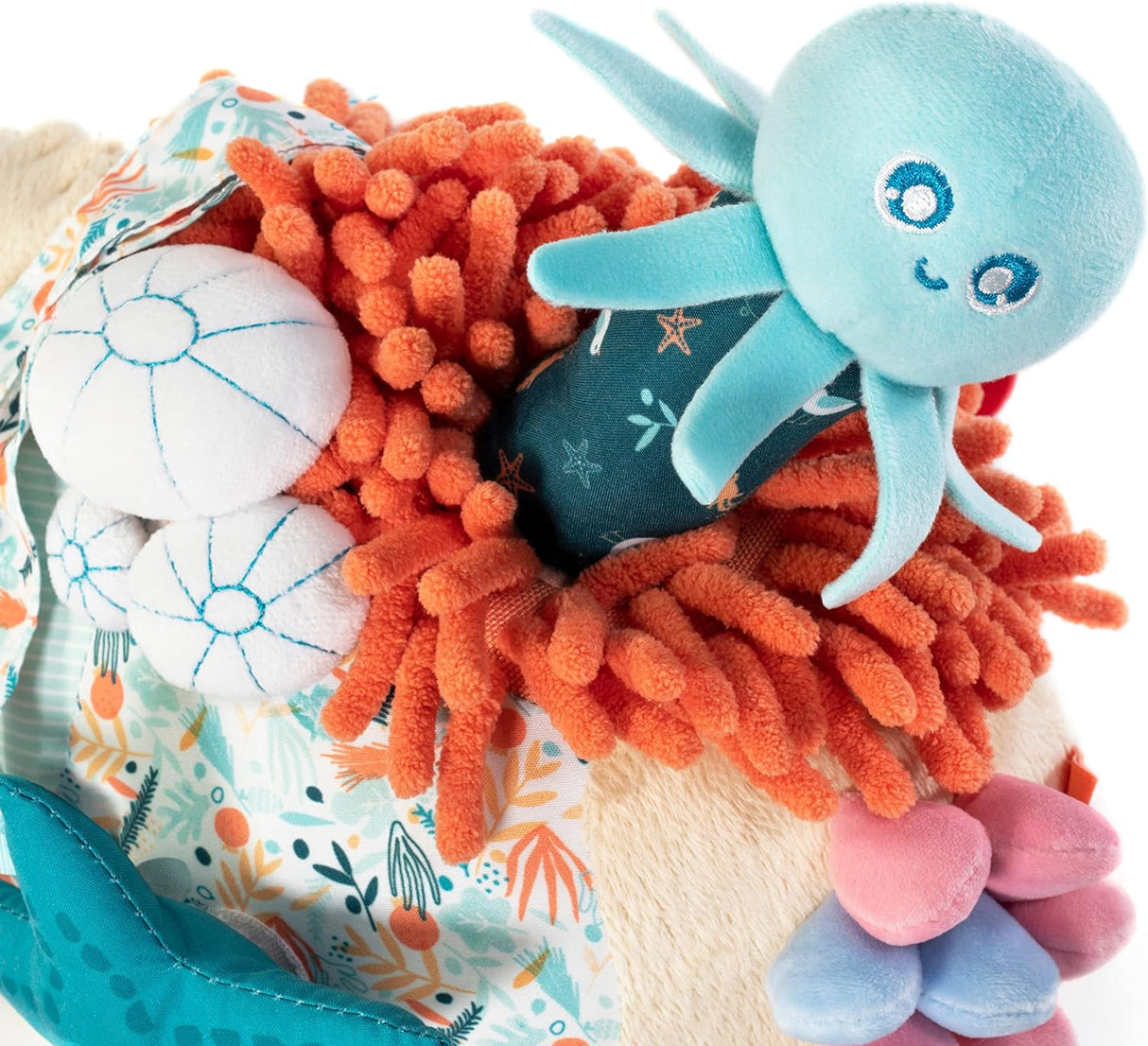 Sensorial Reef toy featuring a baby octopus rattle with squeezable coral textures for sensory play and exploration.