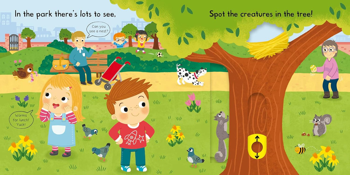 Busy Park Push/Pull/Slide board book showing children playing, animals, and nature in a colorful park scene.