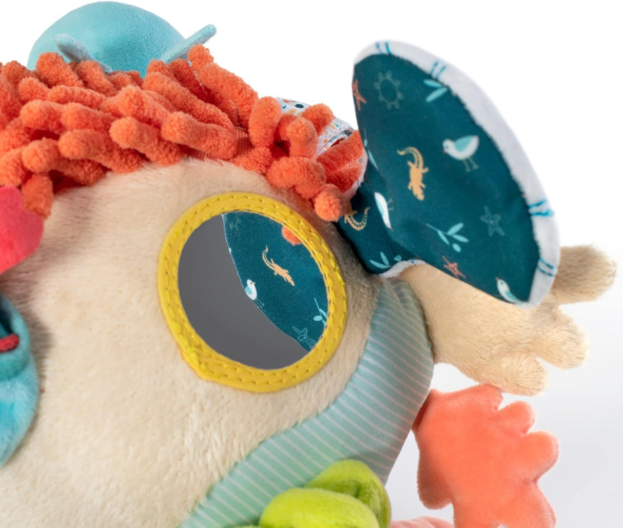 Close-up of Sensorial Reef baby toy showing soft fabric, textured coral, and mirror for sensory exploration.