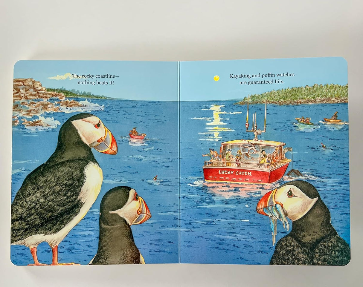 My Maine" book spread showing puffins, rocky coast, and a red boat named Lucky Catch on blue water.