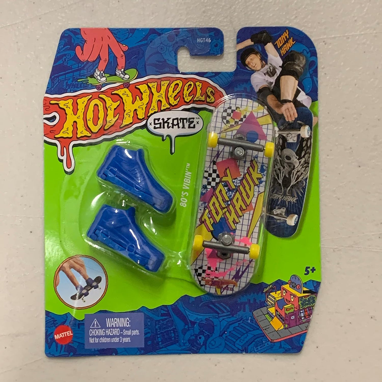 Hot Wheels Skateboard & Shoes featuring a mini skateboard and blue shoes in assorted styles for ages 5 and up.