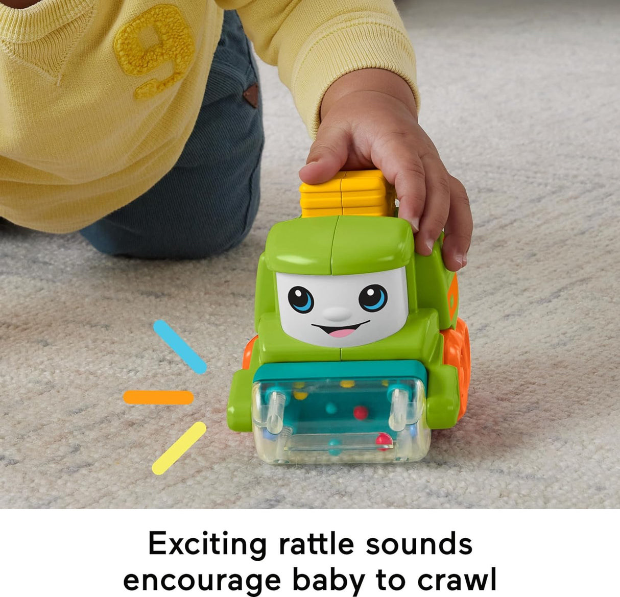 Baby playing with Little People Rollin' Tractor toy featuring bright colors and rattling beads to encourage crawling.