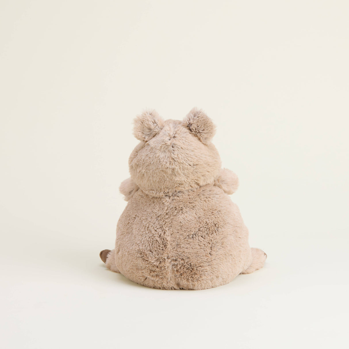 Soft and cuddly Warmies plush quokka viewed from behind against a plain neutral background