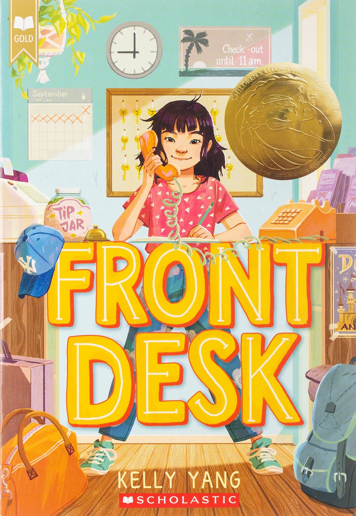 Front Desk book cover showing a girl answering the phone at a motel front desk with colorful, welcoming decor.