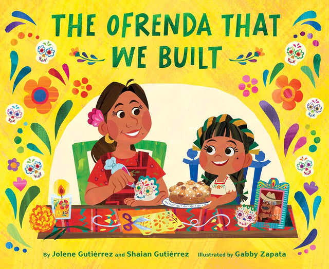 The Ofrenda That We Built book cover showing a joyful mother and child celebrating Day of the Dead with colorful altar items.