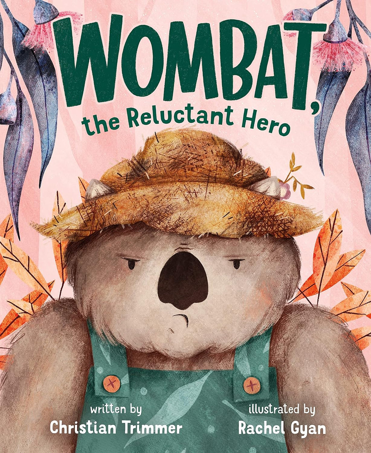 Cover illustration of Wombat wearing a hat and green overalls for the book Wombat the Reluctant Hero