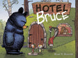 Illustration of a grumpy bear outside a den with animals and a sign reading Hotel Bruce on the cover of a children's book.