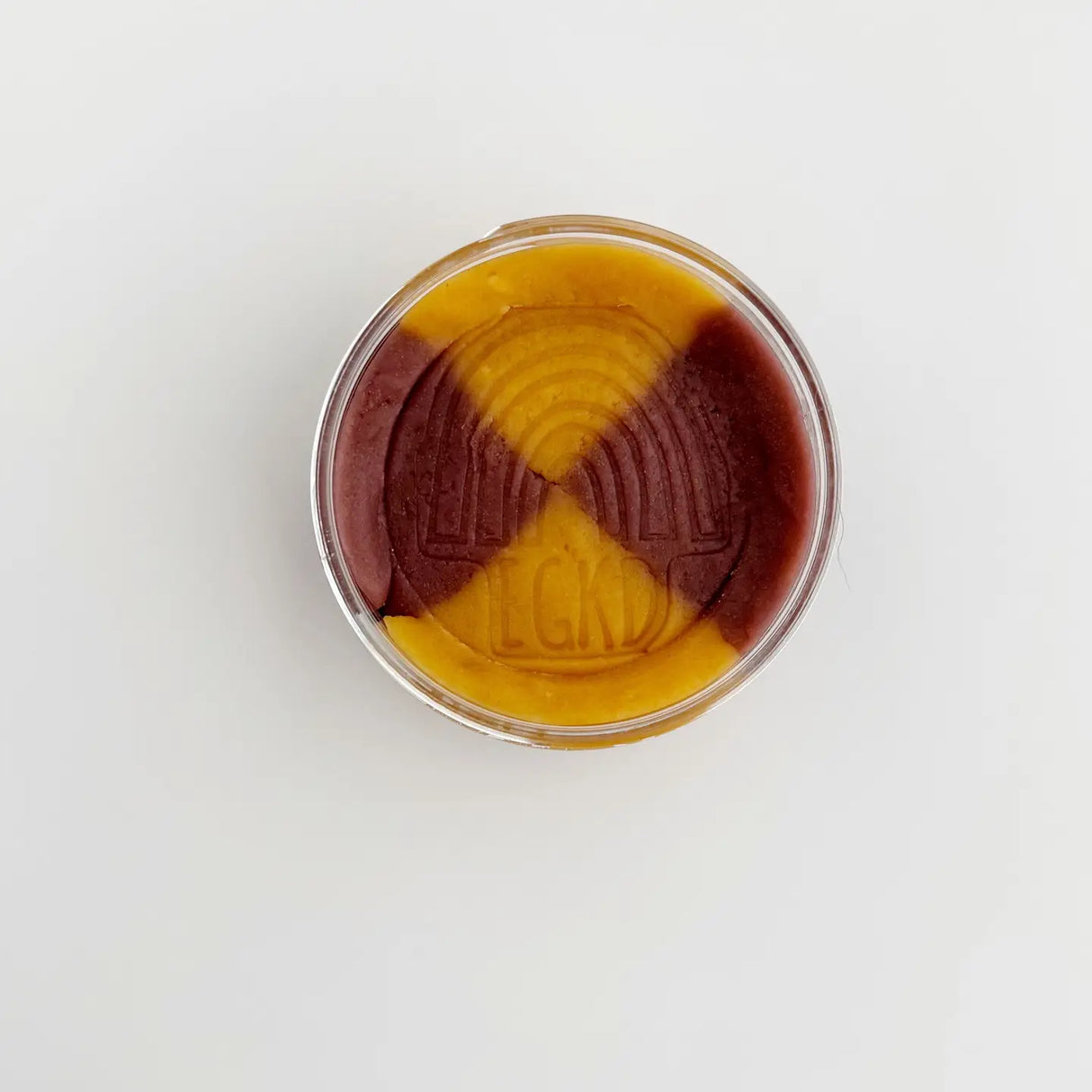 KidDough | Peanut Butter Jelly Time showing golden brown and purple sensory doughs in a container for kids' play.