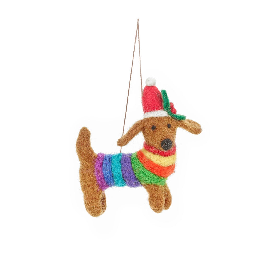 Needle felted dachshund ornament wearing a rainbow striped sweater and red holiday hat hanging by a string