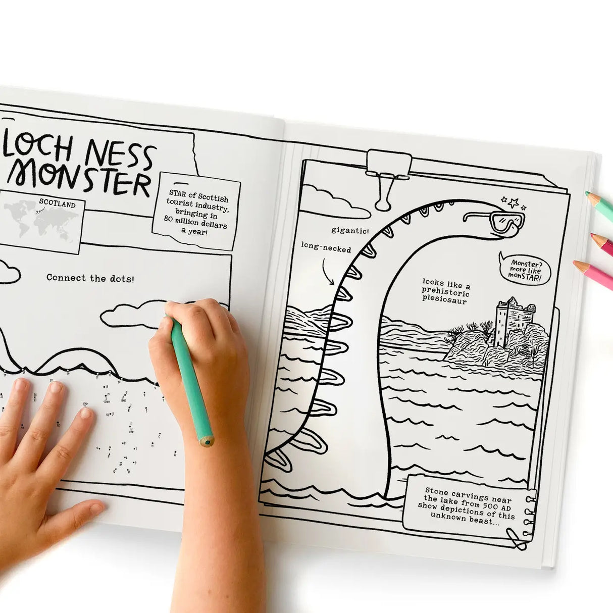 Child coloring a connect-the-dots Loch Ness Monster page in a cryptids activity and coloring book