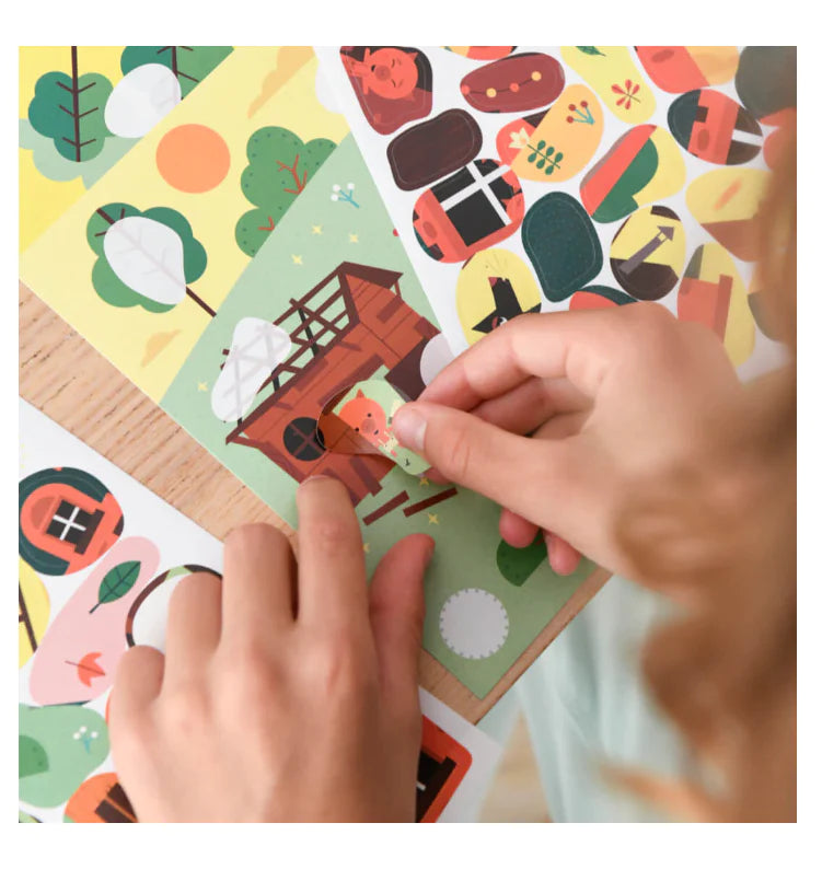 Child applying stickers to colorful cards in the Poppik Sticker Story fairy tale activity set.