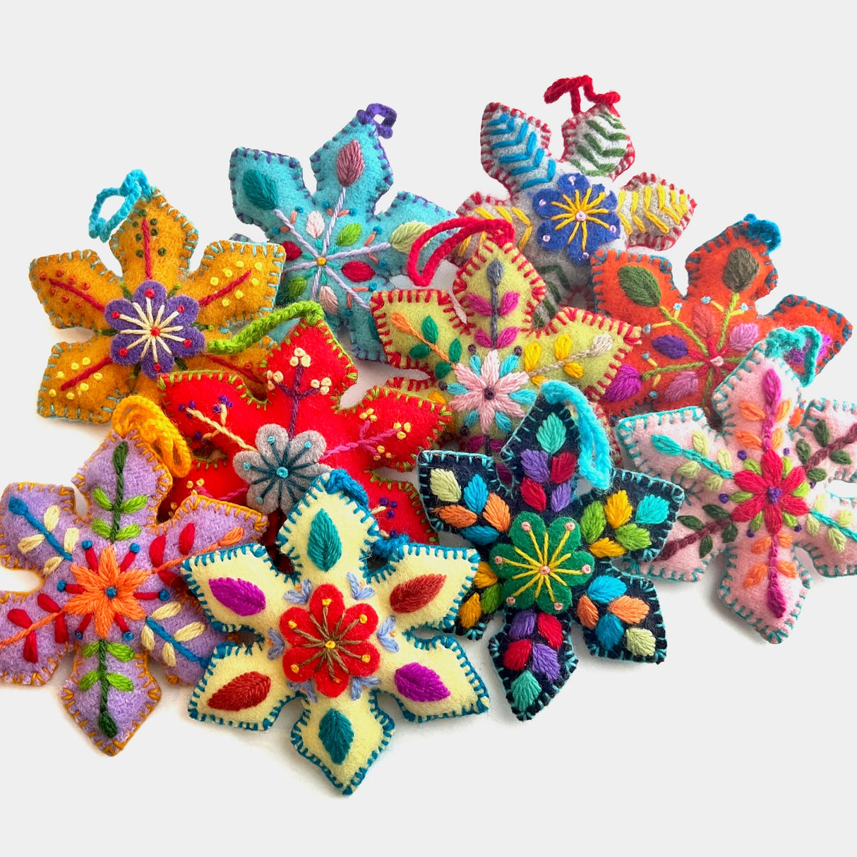 Colorful Snowflake Embroidered Ornament with vibrant handmade wool embroidery in assorted bright patterns from Peru.