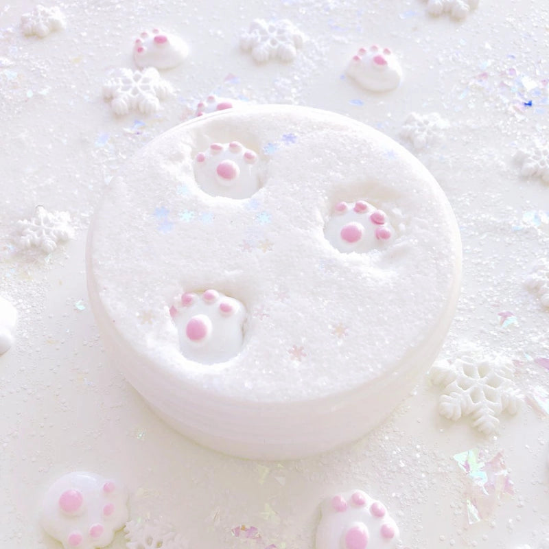 Polar Bear Tracks Cloud Slime is fluffy white with sparkling texture and soft pink paw prints on top.