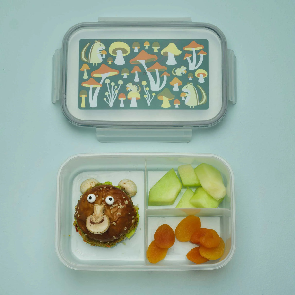 Good Lunch Bento Box | Mostly Mushrooms with chipmunk and mushroom design, featuring three compartments with fruit and a bear-shaped sandwich.
