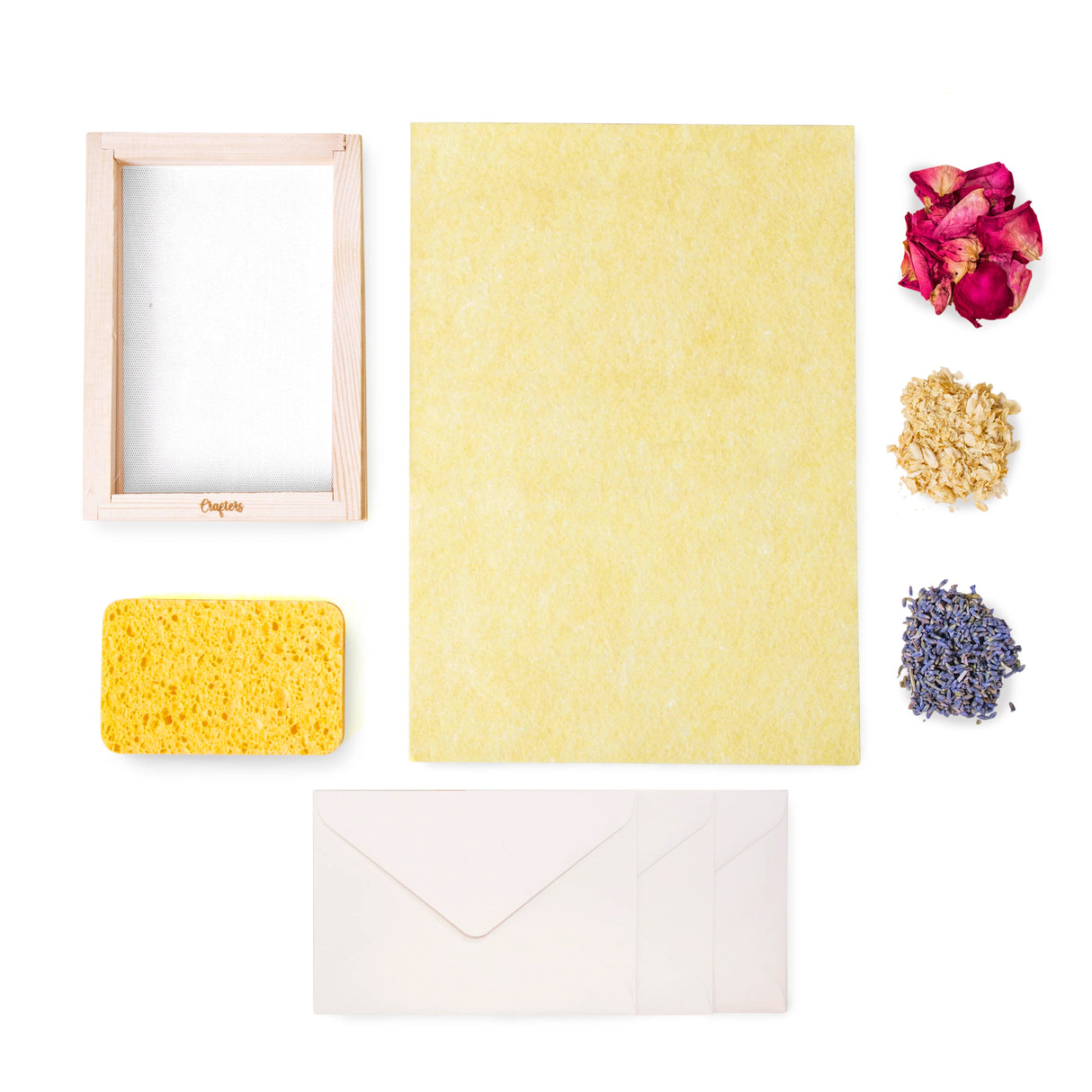 Crafters Flower Paper Kit with wood frame, sponge, flower petals, reusable cloth, and envelopes for DIY paper crafting.