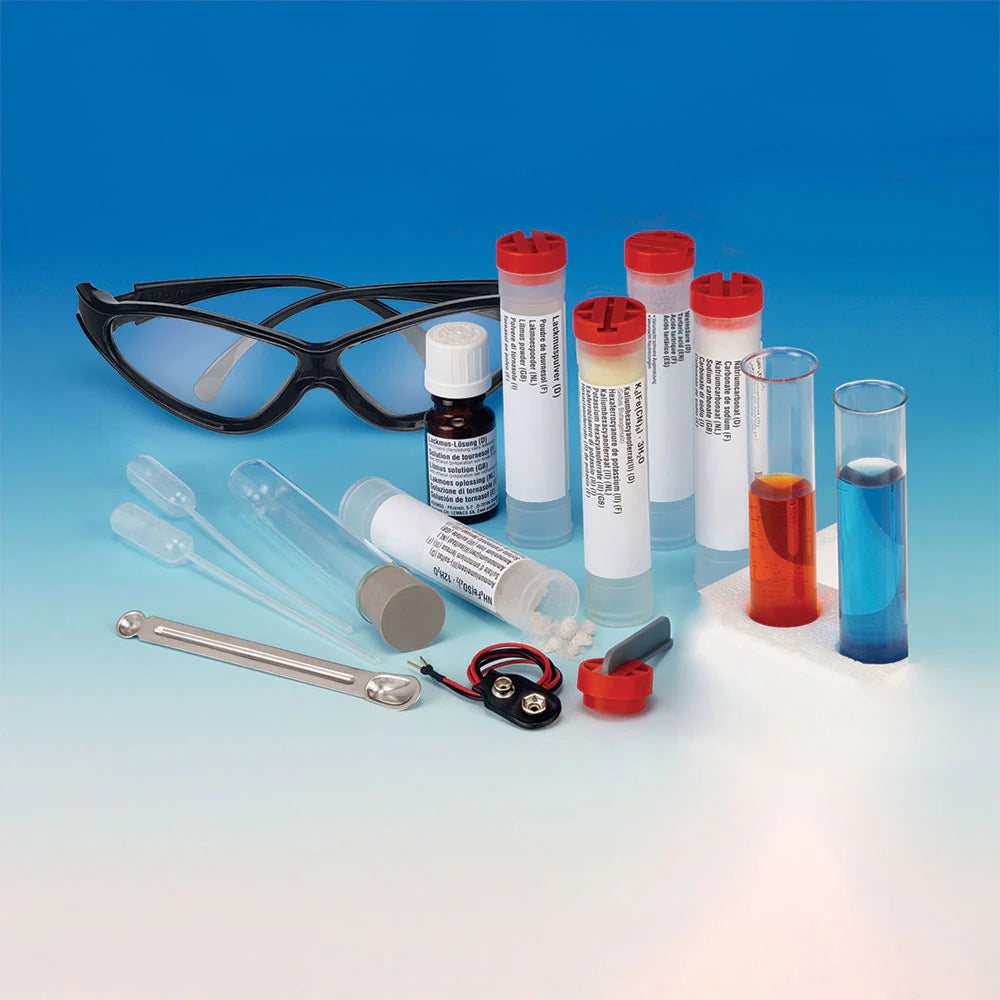 Chemistry 500 set with safety glasses, test tubes, droppers, battery clip, and reagents for colorful science experiments
