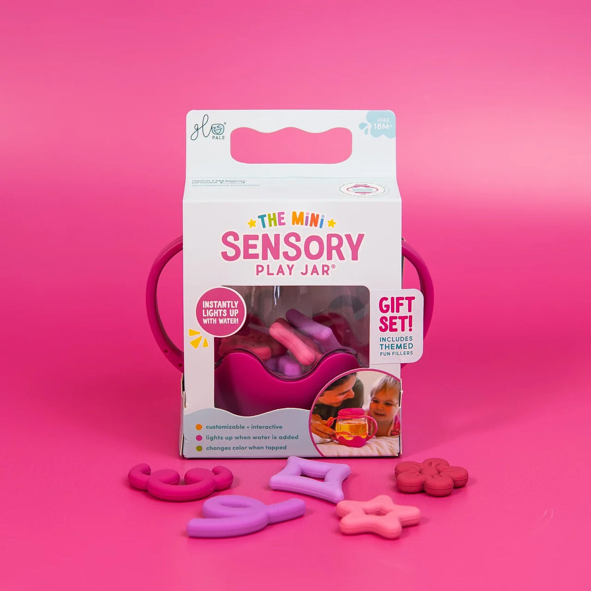 Mini Sensory Jar | Pink packaging with pink sensory fidget pieces displayed on a bright pink background