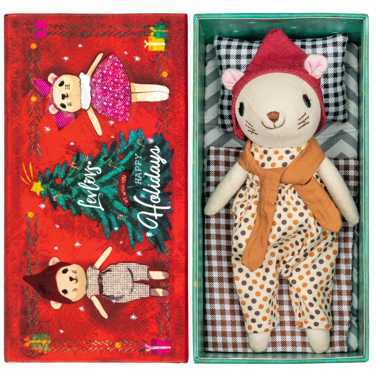 Winter Mouse Boy plush in polka dot outfit with red hood lying on patterned pillow inside festive green box