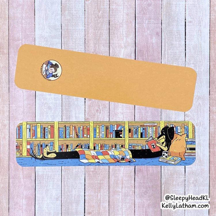 Reading Dog Bookmark showing a cozy dog under a blanket with books on a colorful shelf design.