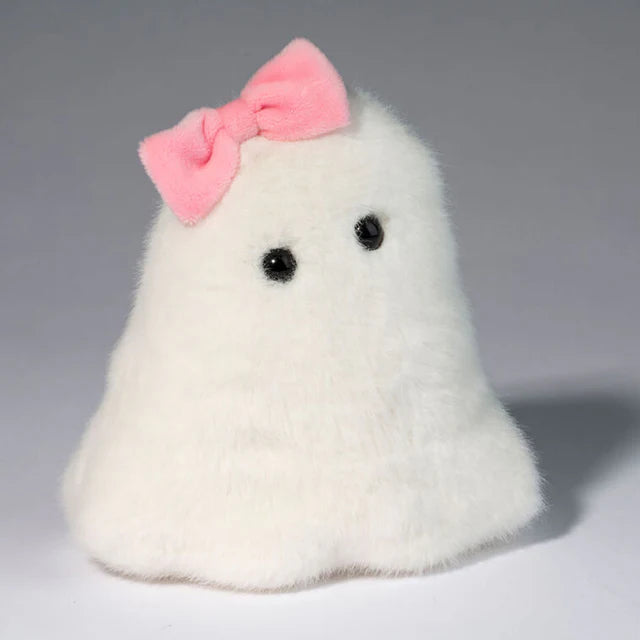 Soft white plush ghost toy with black eyes and a pink bow on a neutral background