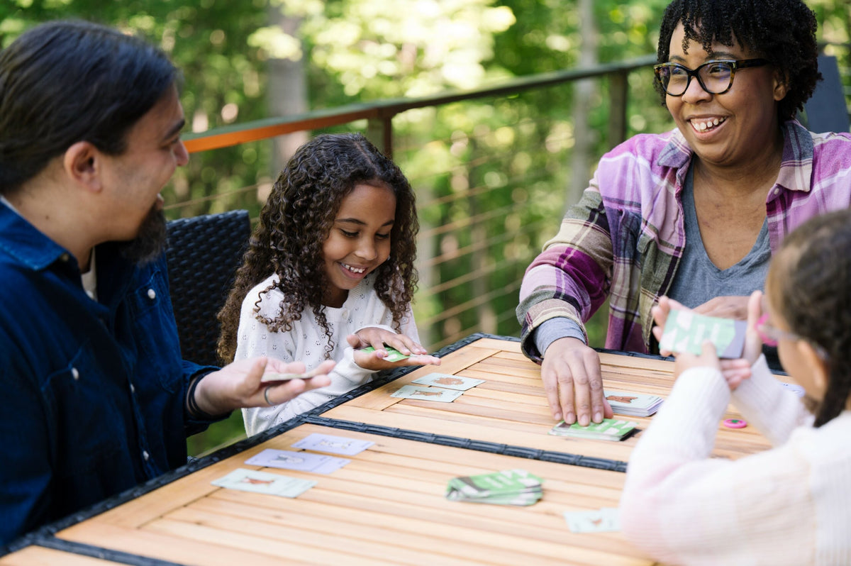 Moose Match Mayhem game played by a family at an outdoor table