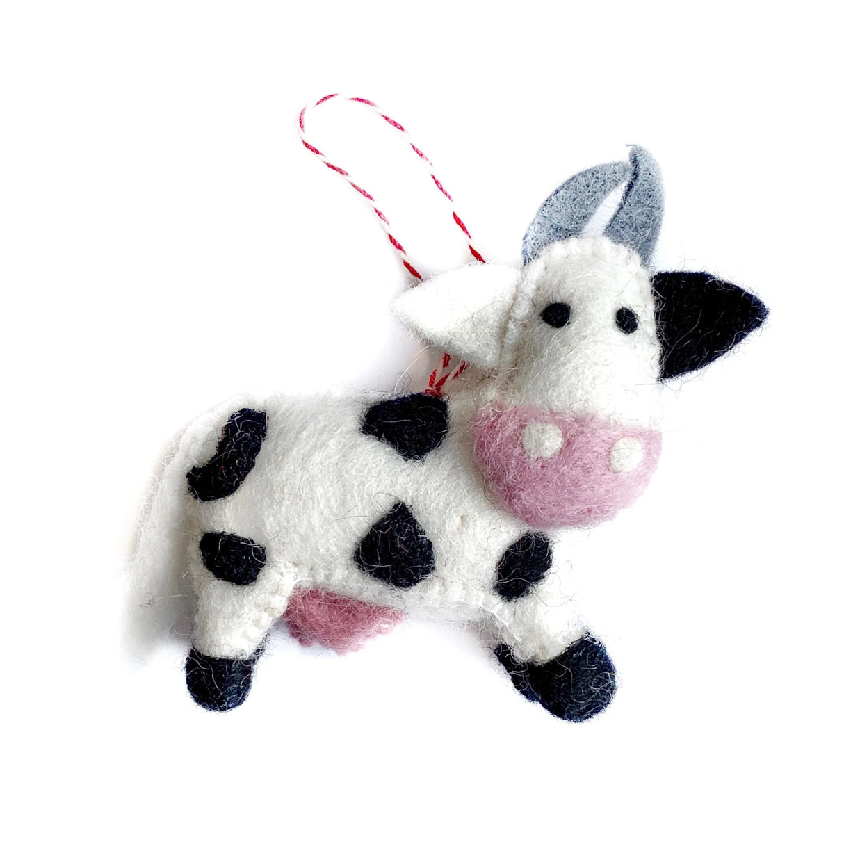 Cow Felt Ornament handmade from colorful sheep wool, featuring a cute black and white cow design with pink details.