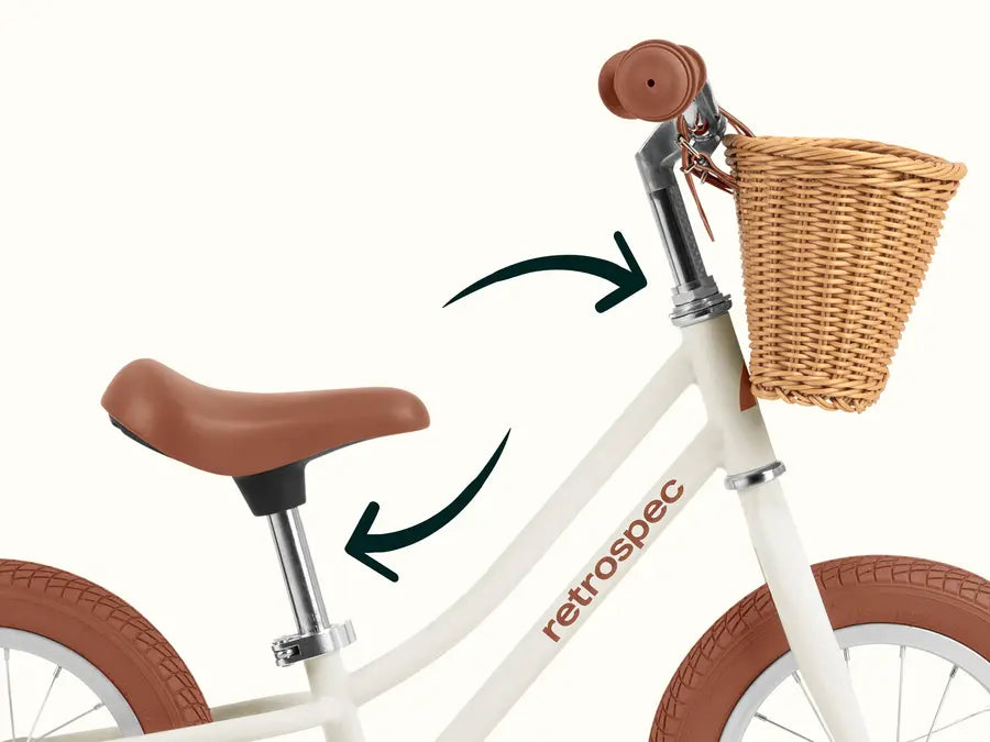 Baby Beaumont Balance Bike | Blush with adjustable seat and handlebars and a woven basket for little riders.