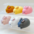 Rabbit Figurine set with six colorful 2-inch miniature rabbits, made with care and perfect for ages 3 and up.