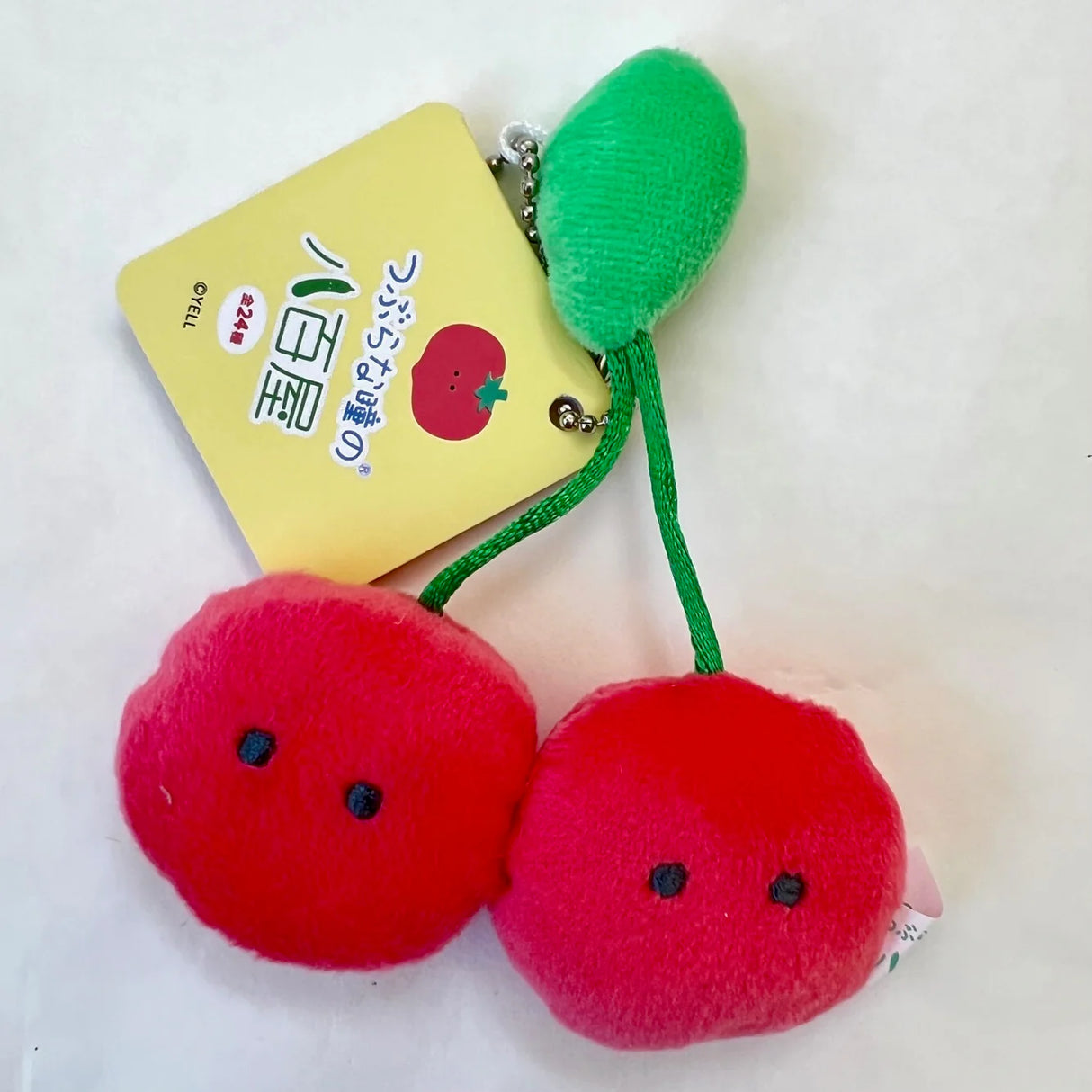 Fruit or Veggie Charm plush red cherry keychain with green stem, soft and cute accessory for backpacks or bags.