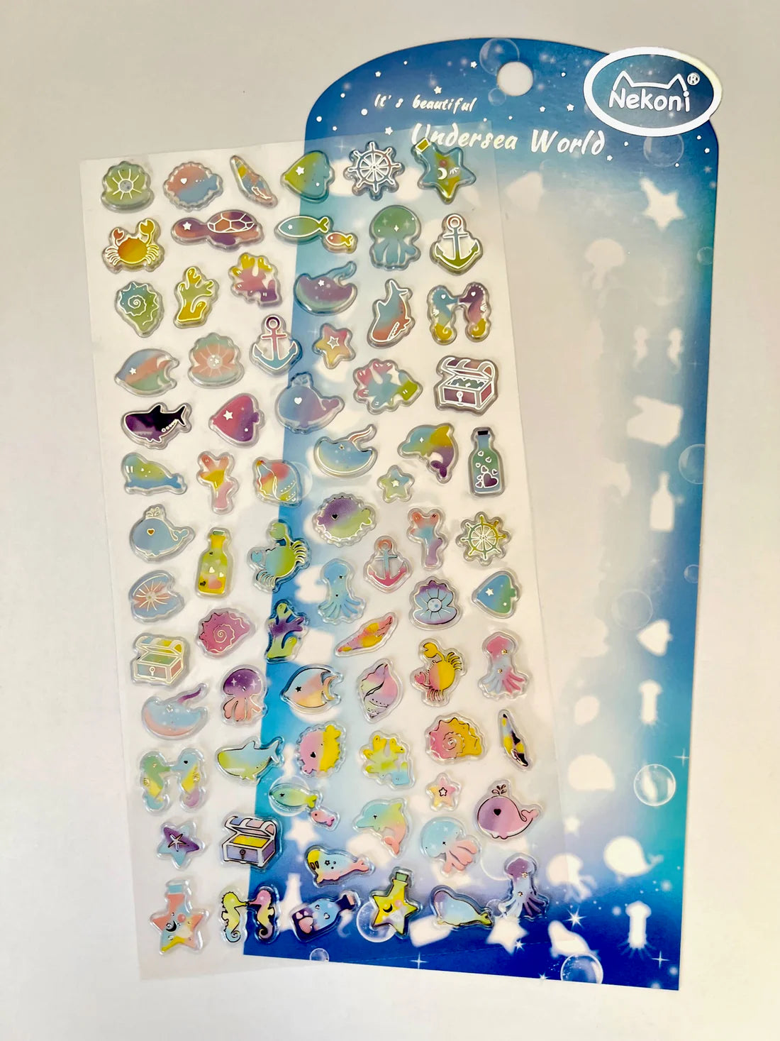 Ocean Shiny Rainbow Stickers featuring colorful undersea creatures and objects on a single sheet for creative decoration.