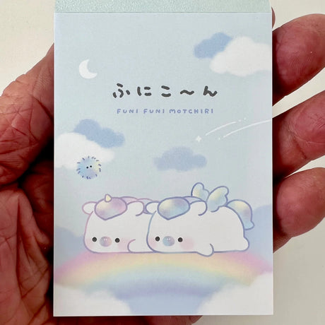 Mini Notepad | Unicorn Funi with pastel unicorns on clouds and rainbow, full-color pages, petit art size.