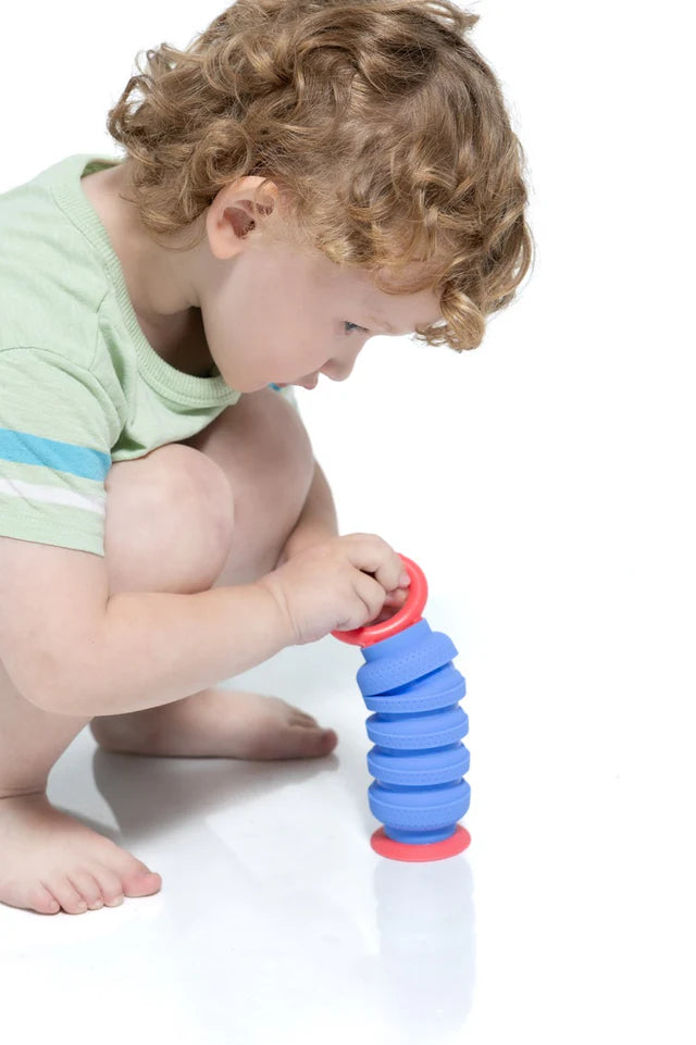 Child playing with Krumples | Plungy, a colorful, engaging silicone fidget toy designed for toddlers and all ages.