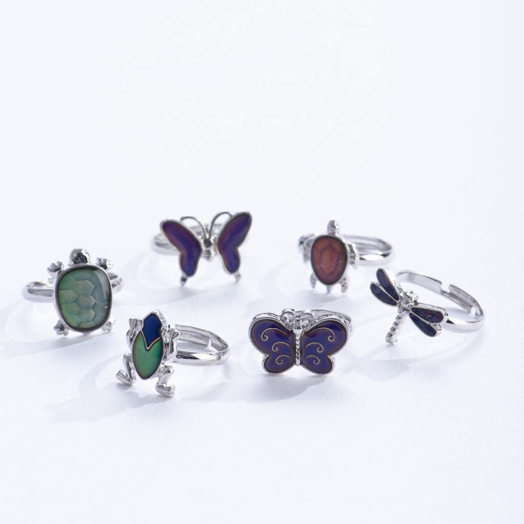 Mood Ring | Outdoor Creature featuring adjustable brass rings with vibrant animal designs like frogs, butterflies, and dragonflies.