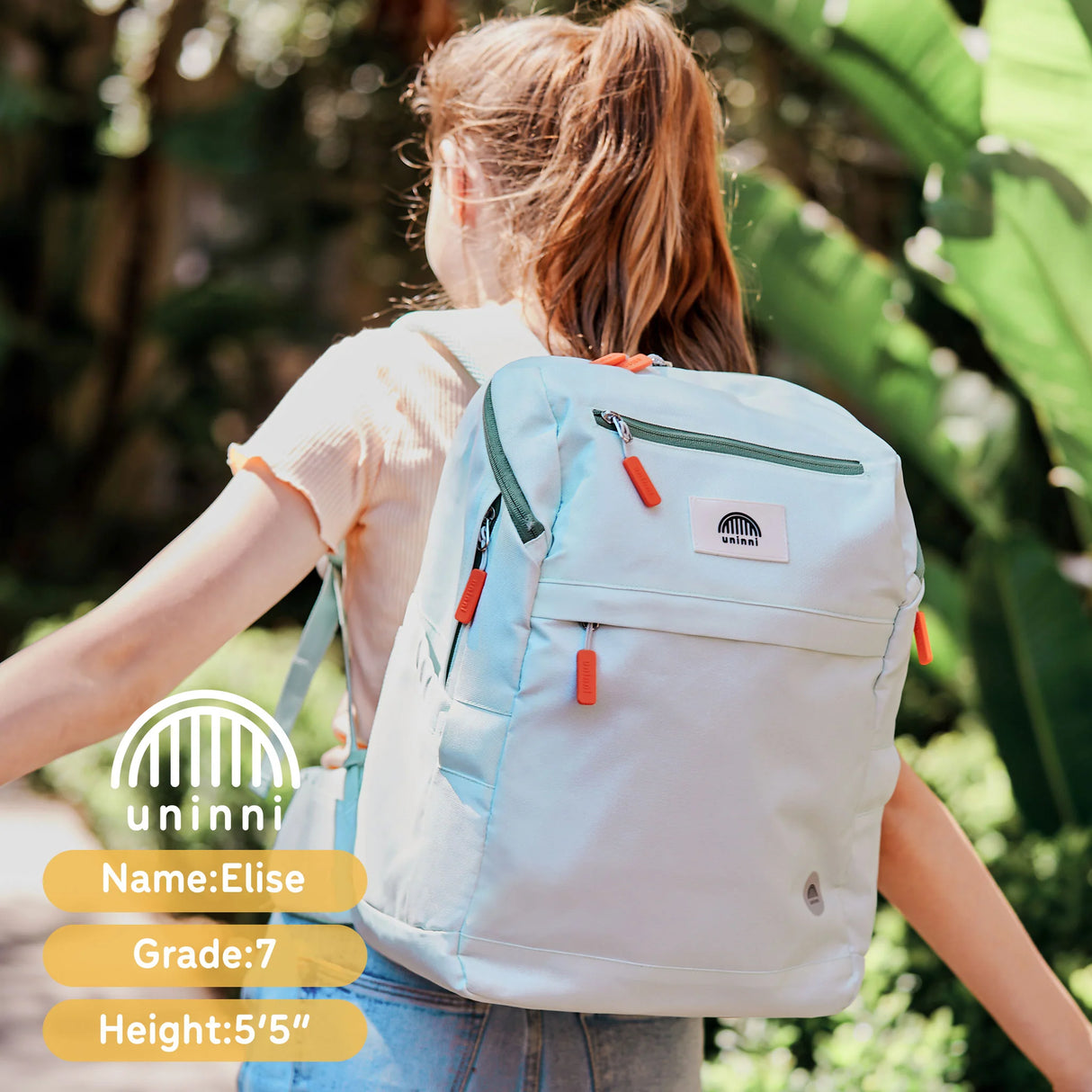 Backpack | Crisp Mint worn by a girl outdoors showing padded straps and multiple compartments in natural light.