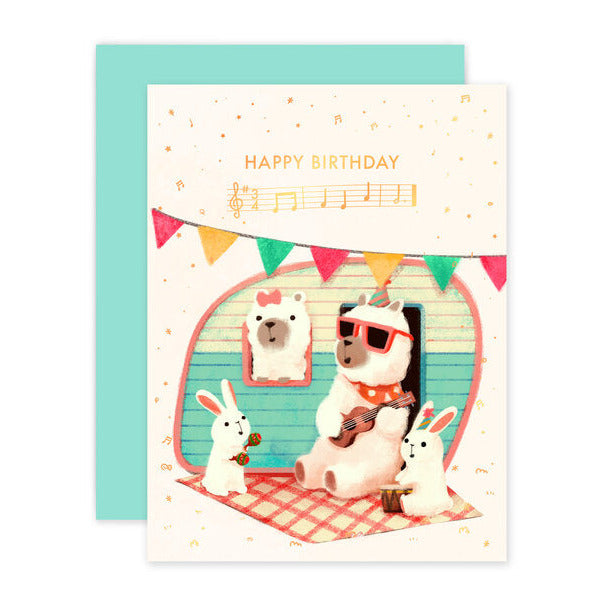 Birthday Alpaca Card featuring a cute alpaca with sunglasses playing guitar and two bunnies celebrating music.