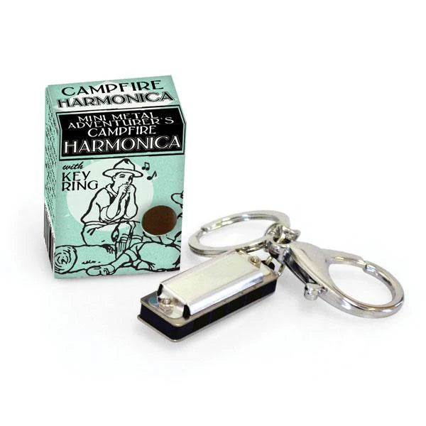 Silver harmonica on a key-ring sitting next to its box, which measures 1.25" x .75" 1.5". For ages 3 and up.